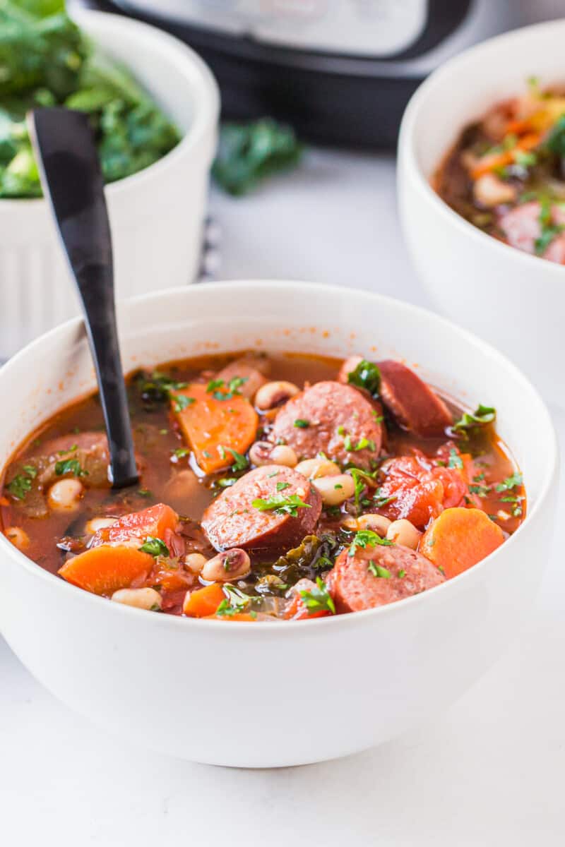 black eyed pea soup with sausage in bowl