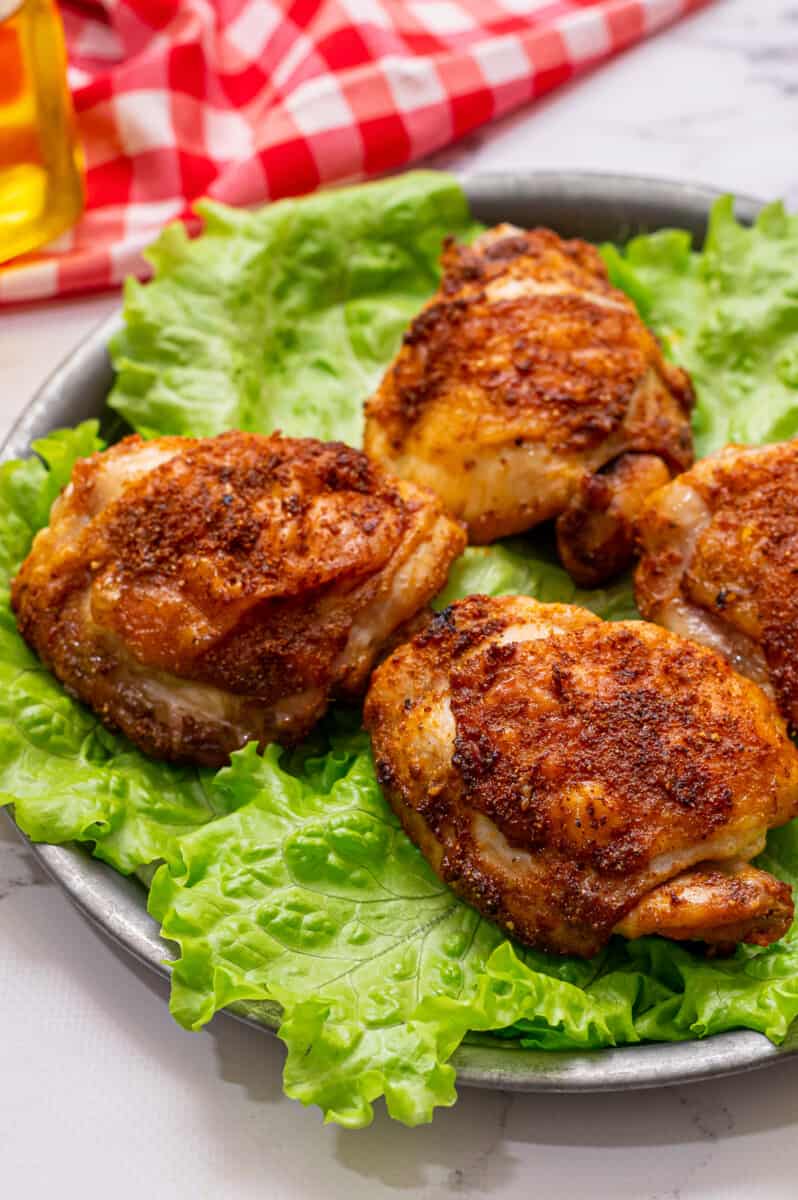 air fryer chicken thighs on bed of lettuce