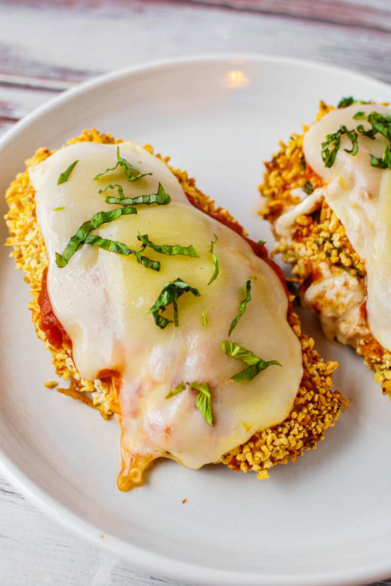 white plate with air fryer stuffed chicken parmesan