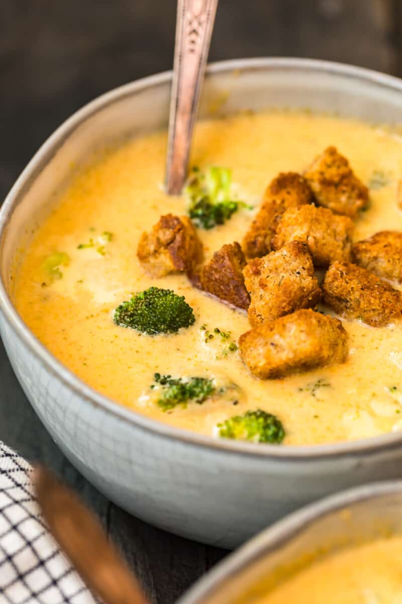 up close broccoli cheese soup in grey bowl