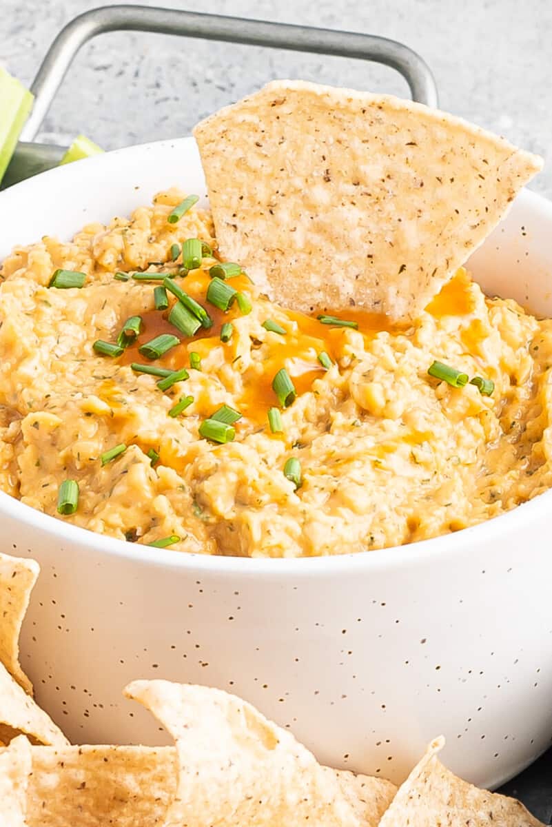 Buffalo chickpea dip in white bowl.