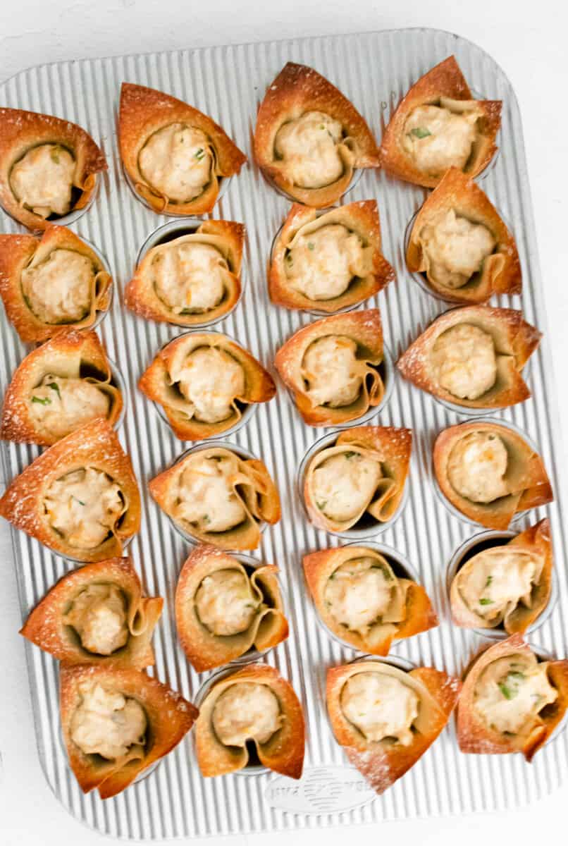 Baking dish with crab rangoon bites.