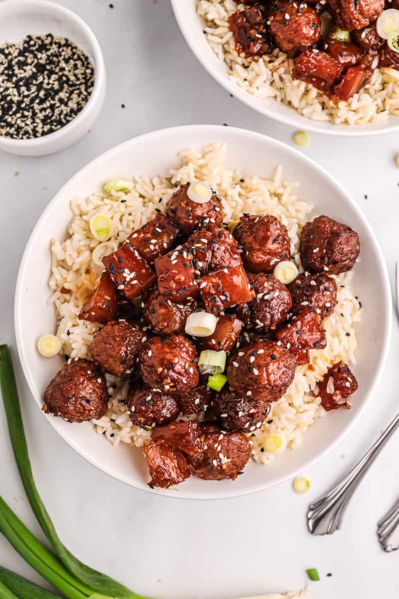 Plate with crockpot teriyaki meatballs and rice.