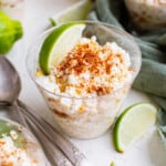 esquites in cups garnished with lime