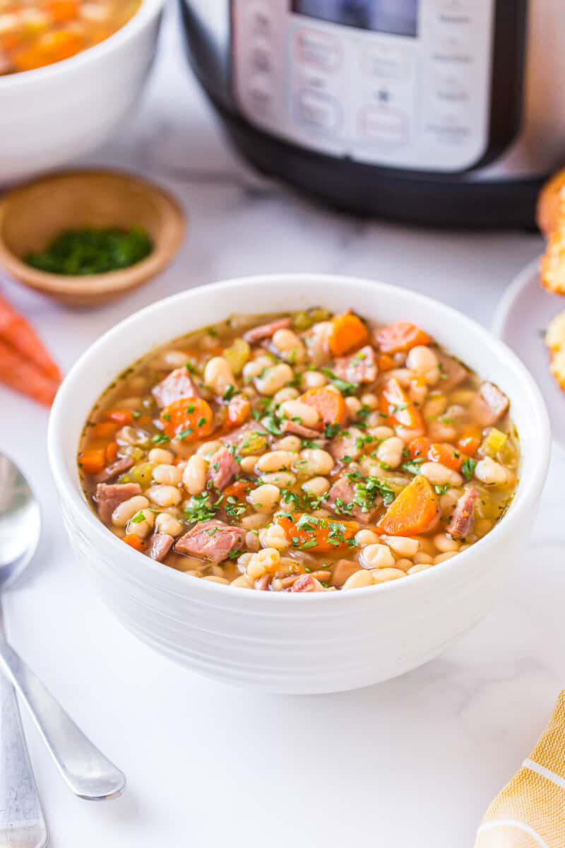white bowl of instant pot ham and bean soup