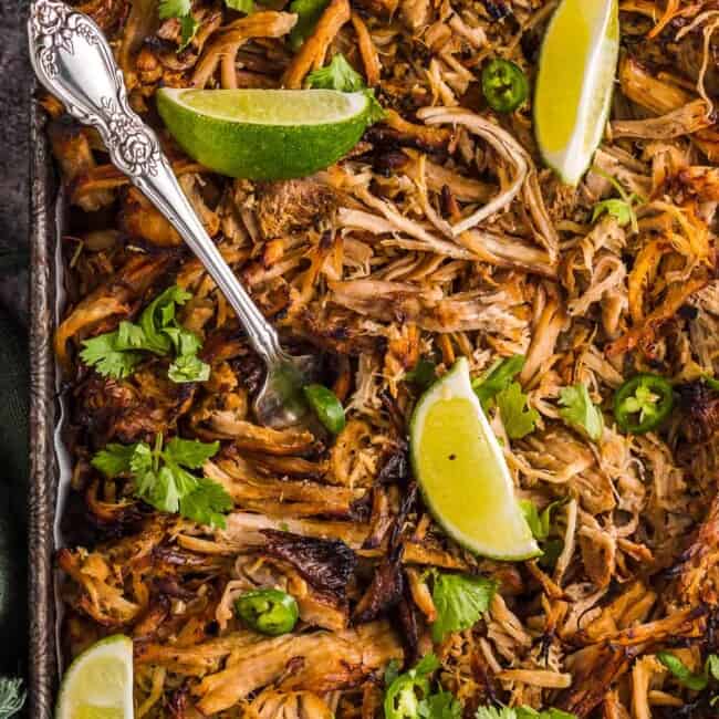 instant pot carnitas garnished with cilantro and lime