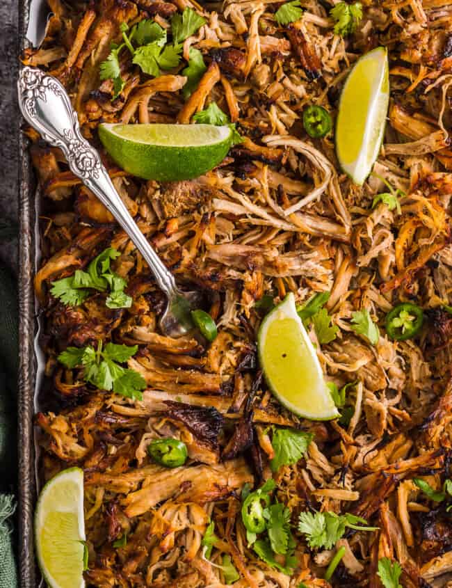 instant pot carnitas garnished with cilantro and lime