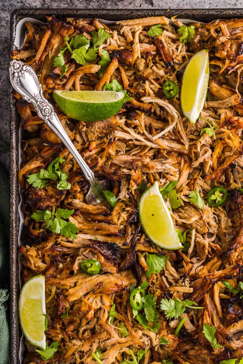 instant pot carnitas garnished with cilantro and lime