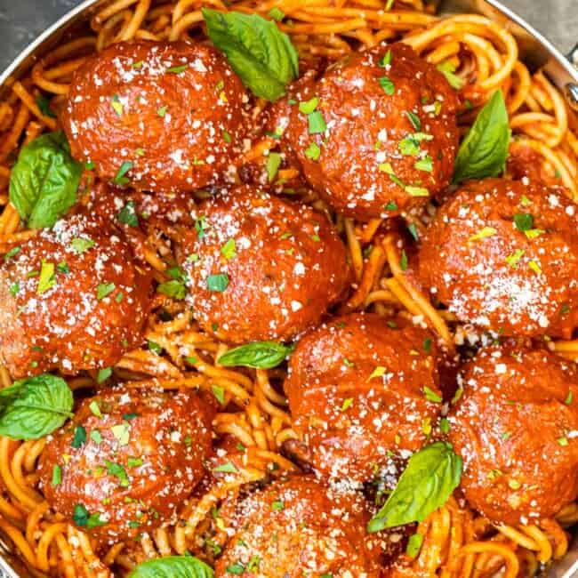 meatballs over pasta in pan