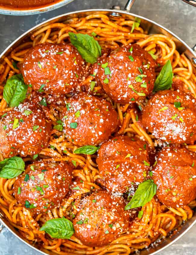 meatballs over pasta in pan