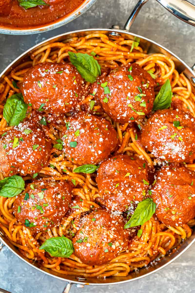meatballs over pasta in pan