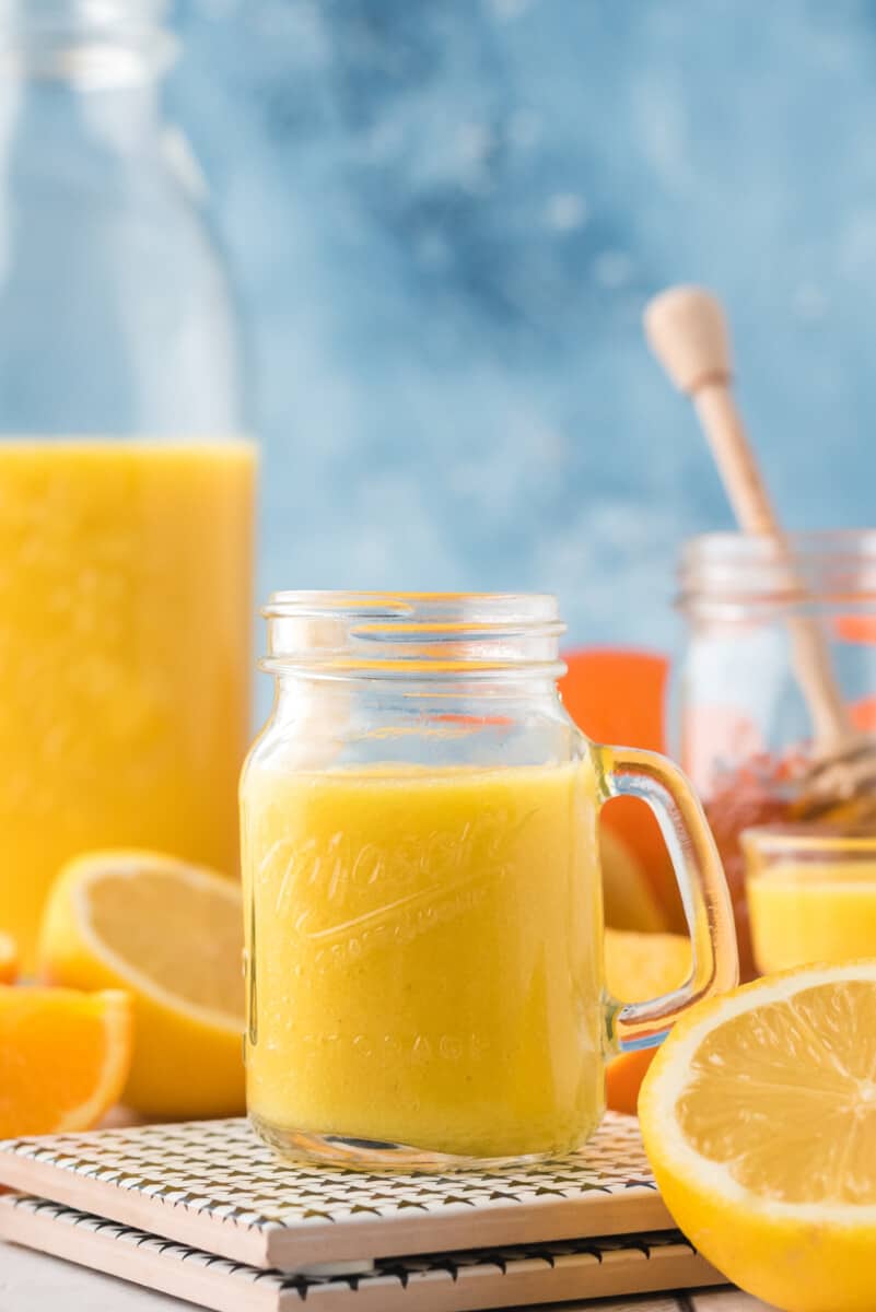 orange ginger shot on table