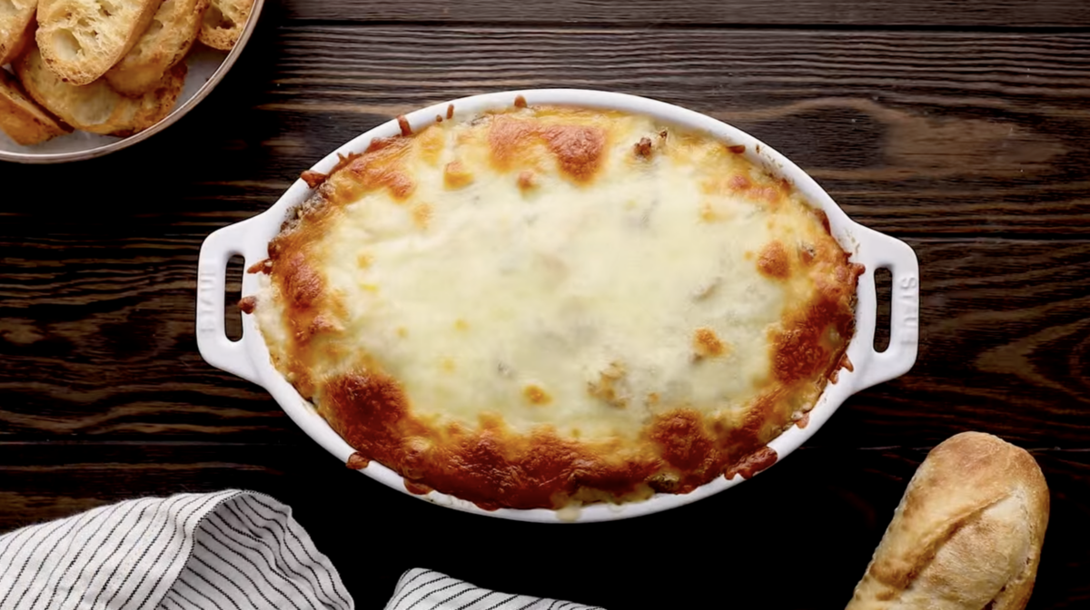 baked philly cheesesteak dip in a baking dish.