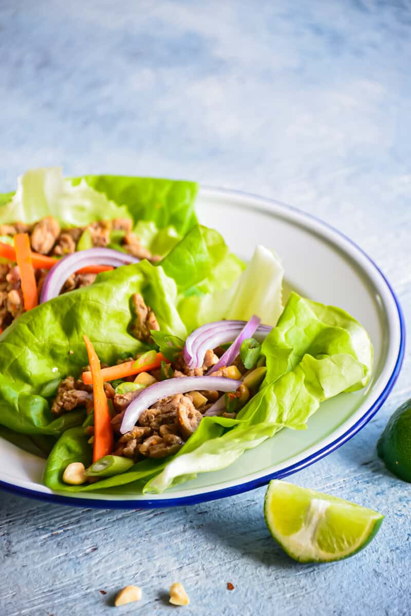 turkey lettuce wraps on a white plate