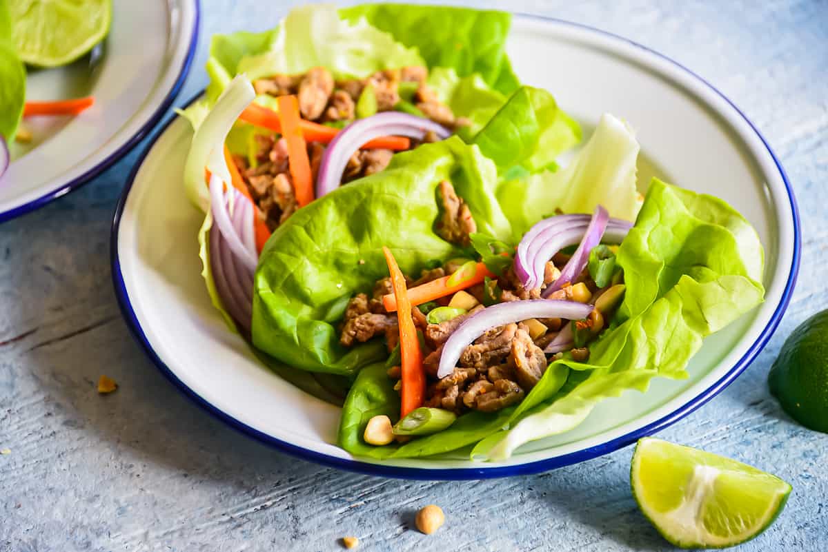 turkey lettuce wraps on a white plate