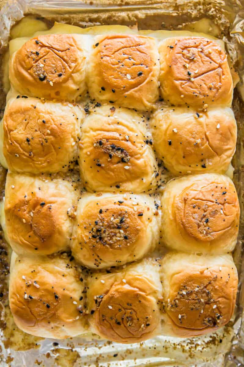 Baked turkey sliders on baking sheet.