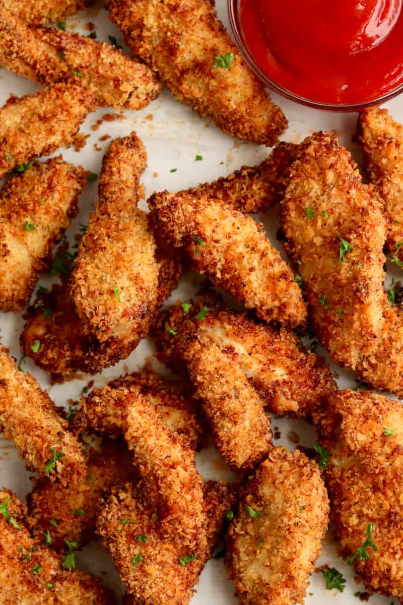 up close air fryer chicken tenders on baking sheet