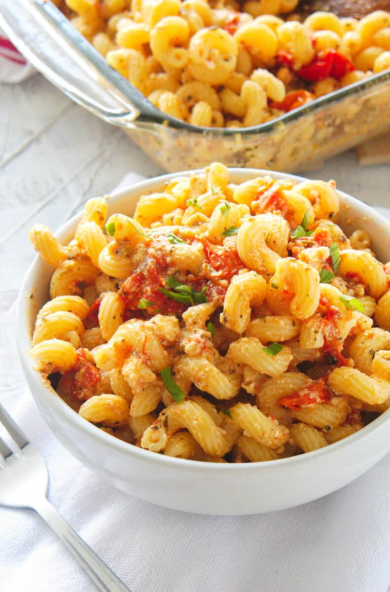 bowl and baking dish with baked feta pasta