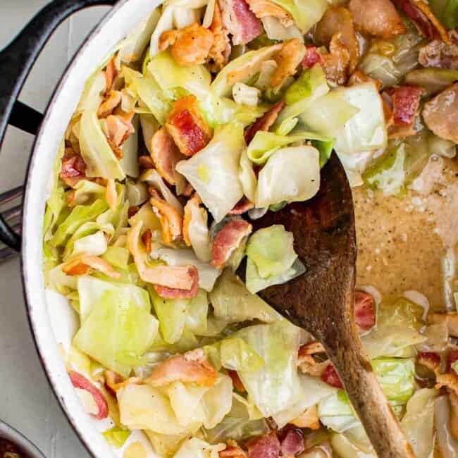 wooden spoon in cabbage and bacon