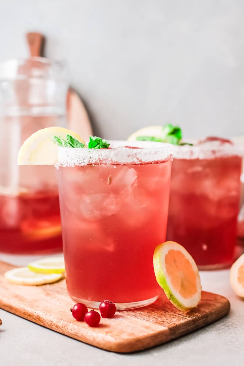 cranberry margaritas in glasses with salt rims
