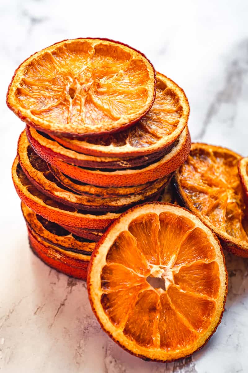 up close stacked dried orange slices on marble