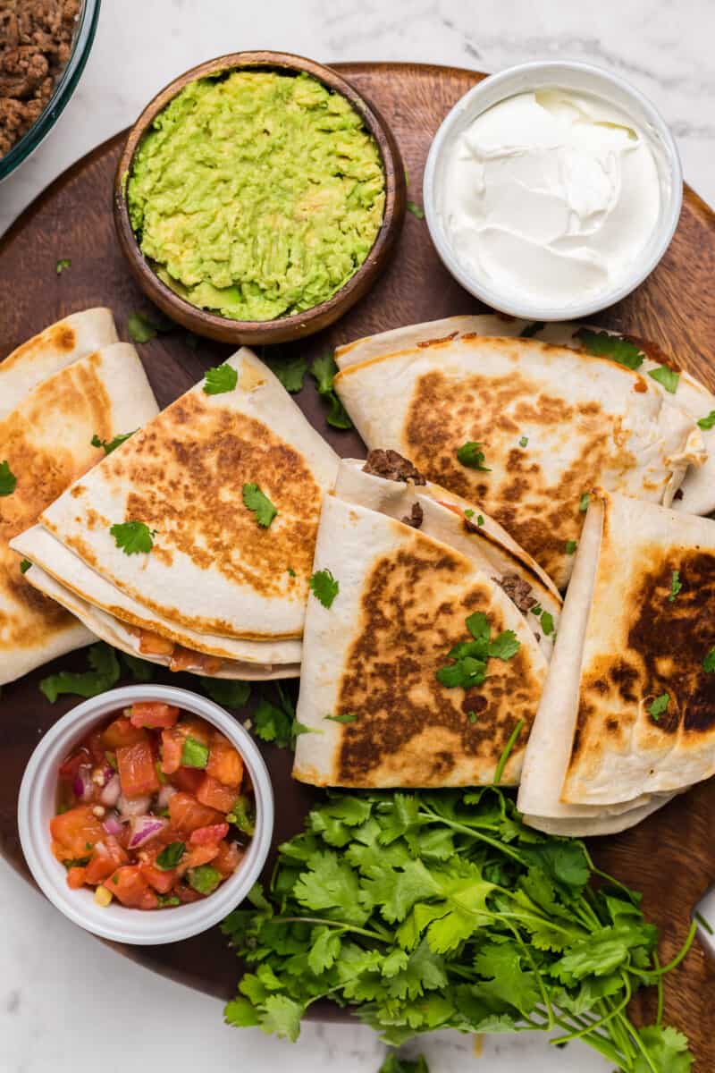 foldover tortilla quesadillas on cutting board