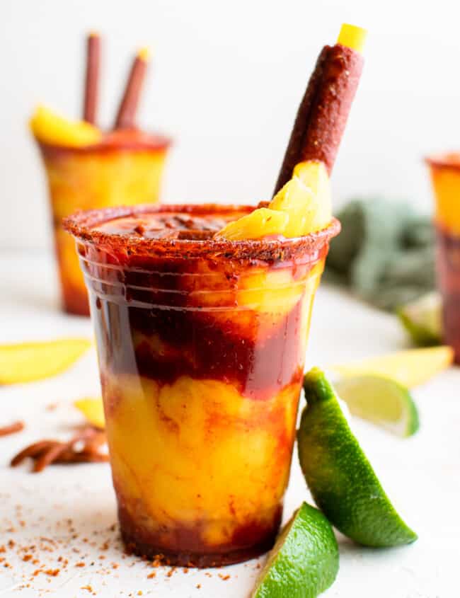 layered mangonadas in plastic cups