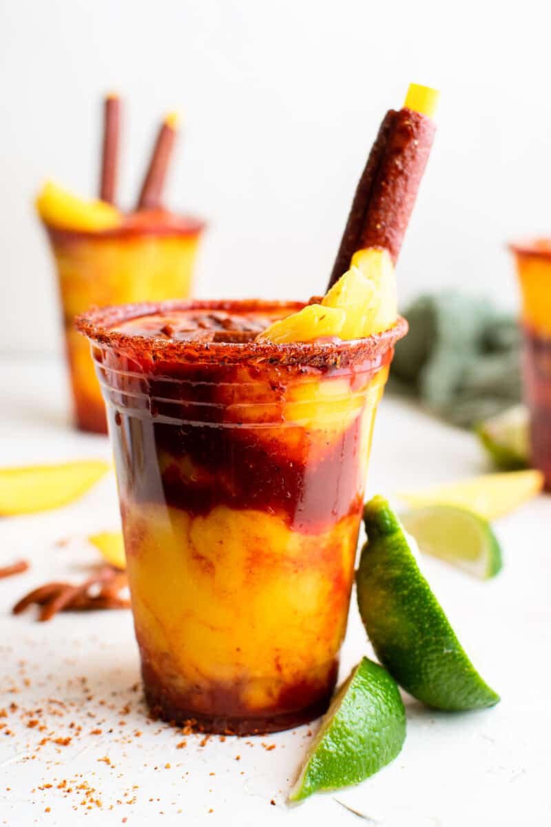 layered mangonadas in plastic cups