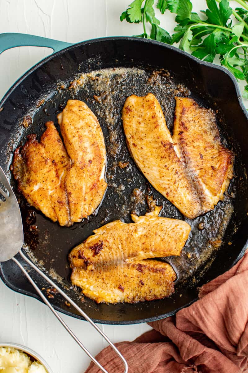 pan fried tilapia in skillet