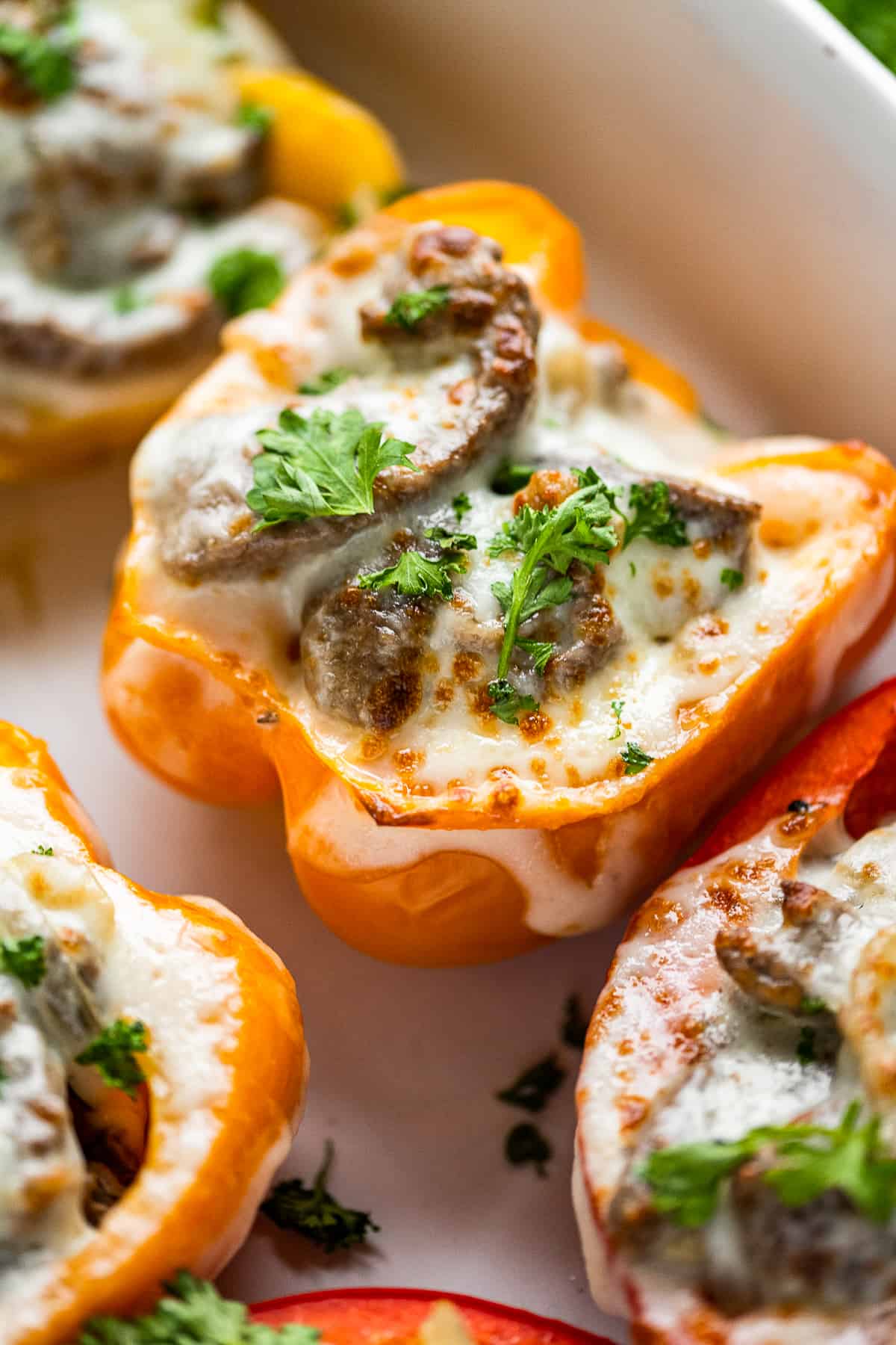 Up close yellow pepper stuffed with Philly cheesesteak.