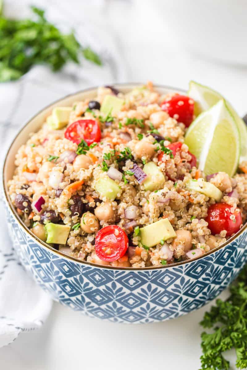 blue bowl filled with quinoa salad