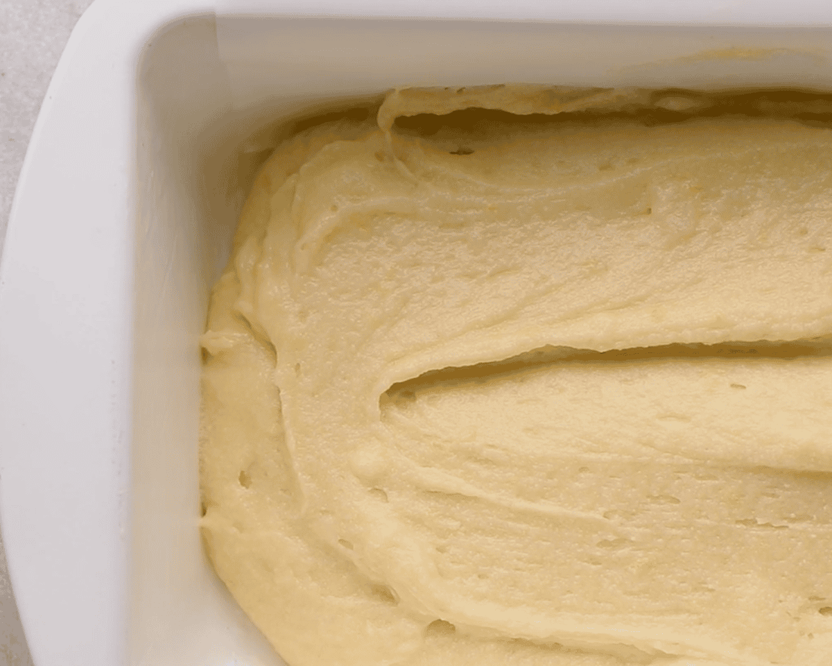 Cake batter in a loaf pan.