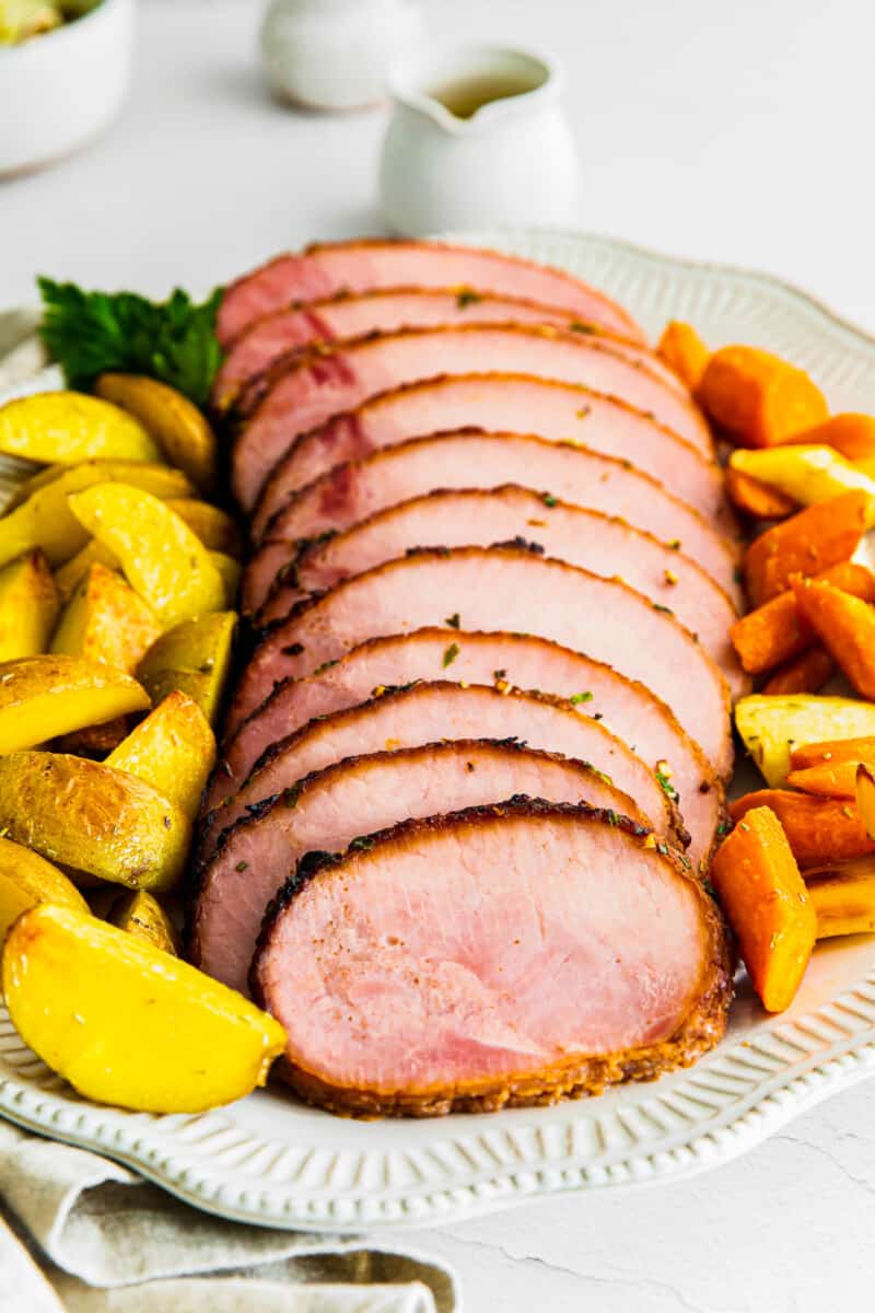 air fryer ham with garlic herb butter on platter