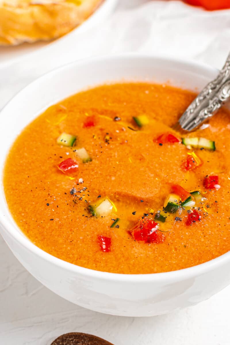 side shot of gazpacho with silver spoon