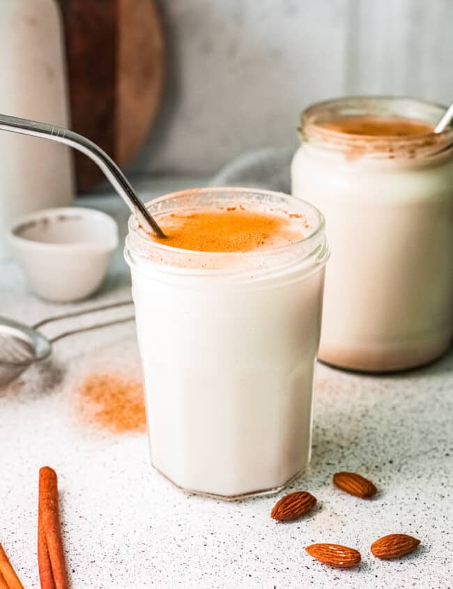two glasses of horchata with metal straws