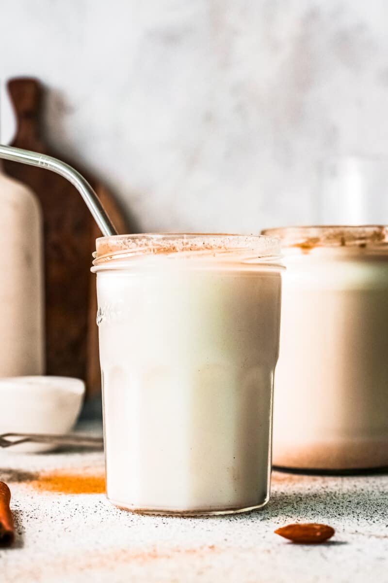 two glasses of horchata with metal straws