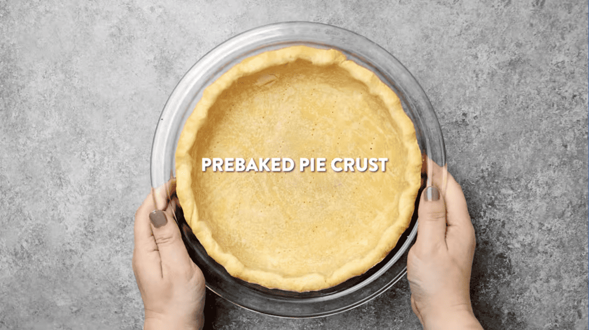 baked pie crust in a glass pie pan.