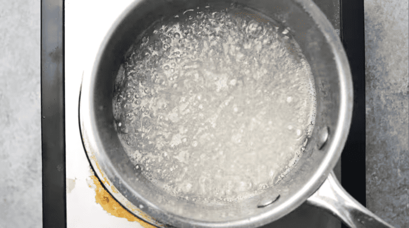 boiling sugar syrup in a saucepan.