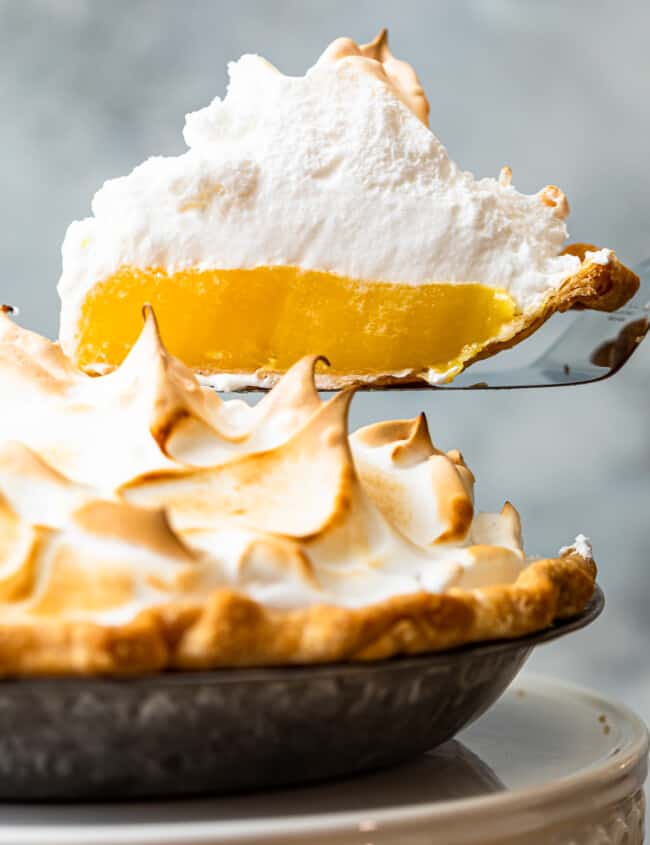 lifting up slice of lemon meringue pie