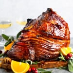 orange glazed ham on platter