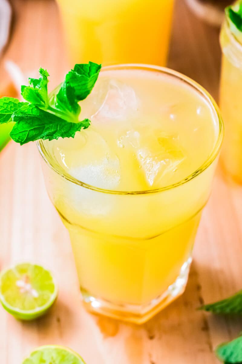 pineapple agua fresca in glass garnished with mint