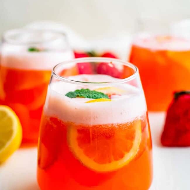 strawberry lemonade in glasses garnished with mint
