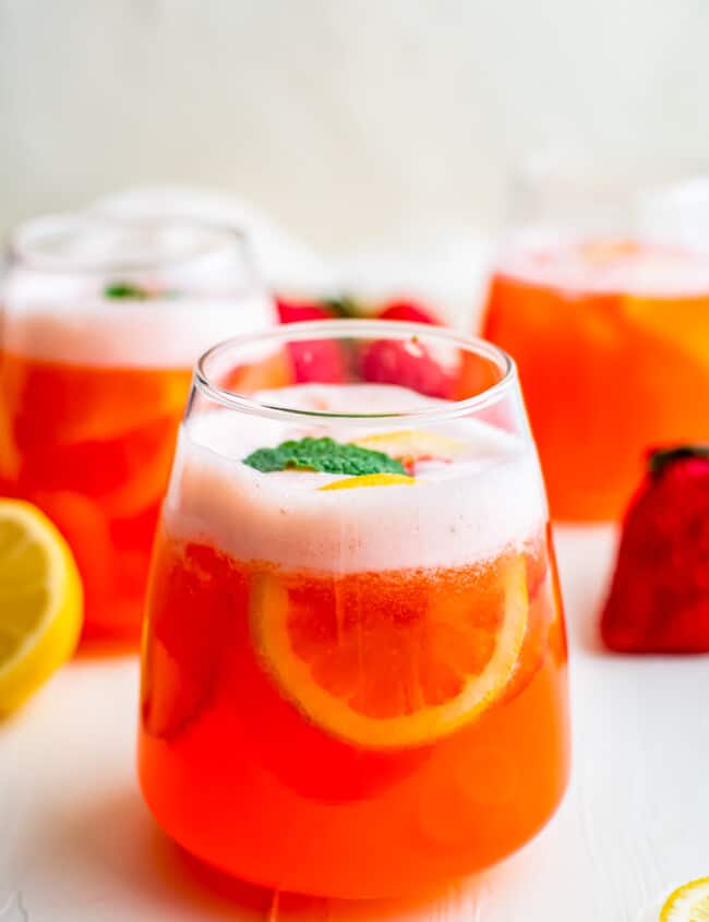 strawberry lemonade in glasses garnished with mint