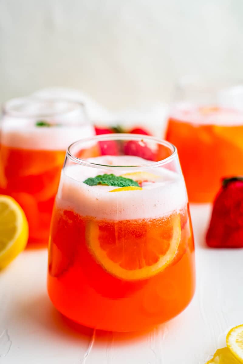 strawberry lemonade in glasses garnished with mint