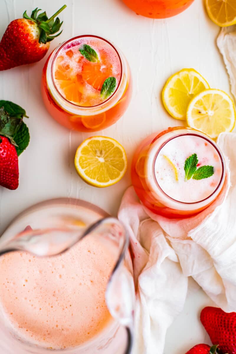 overhead strawberry lemonade in pitcher and glasses