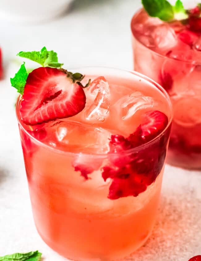 two glasses filled with strawberry palomas