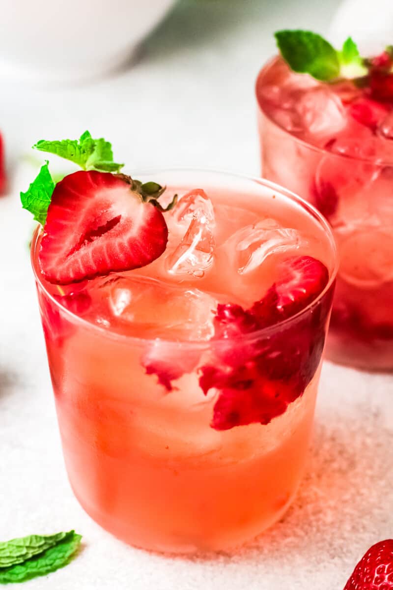 two glasses filled with strawberry palomas