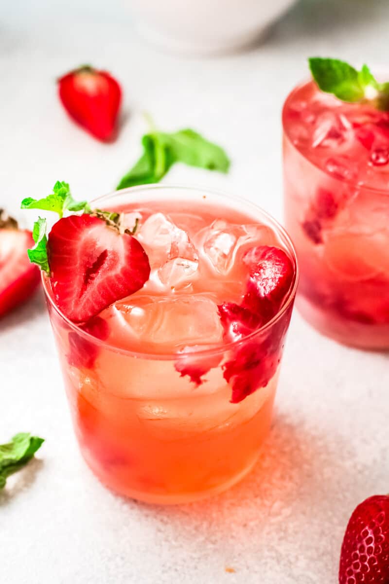 strawberry palomas garnished with strawberry slices