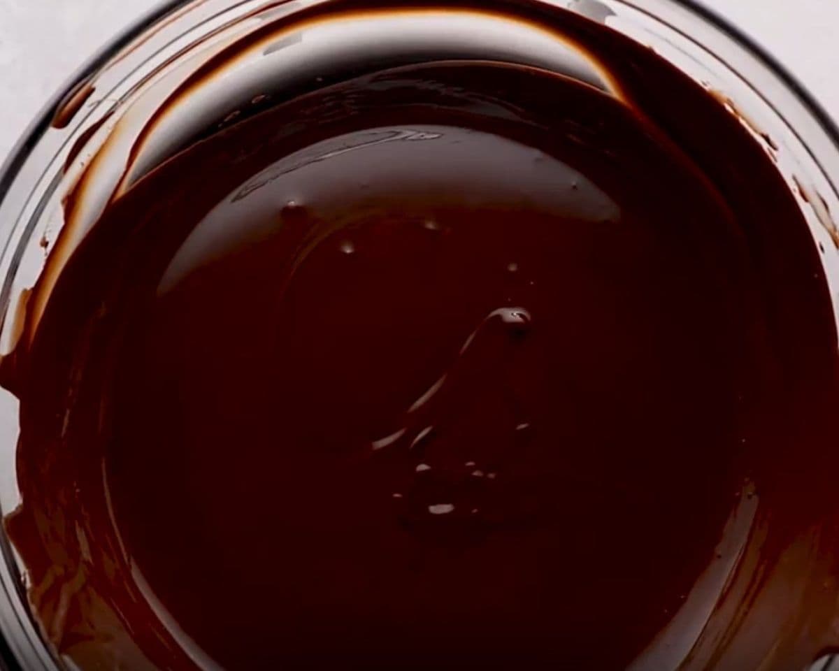 Melted chocolate and butter in a bowl. - 4