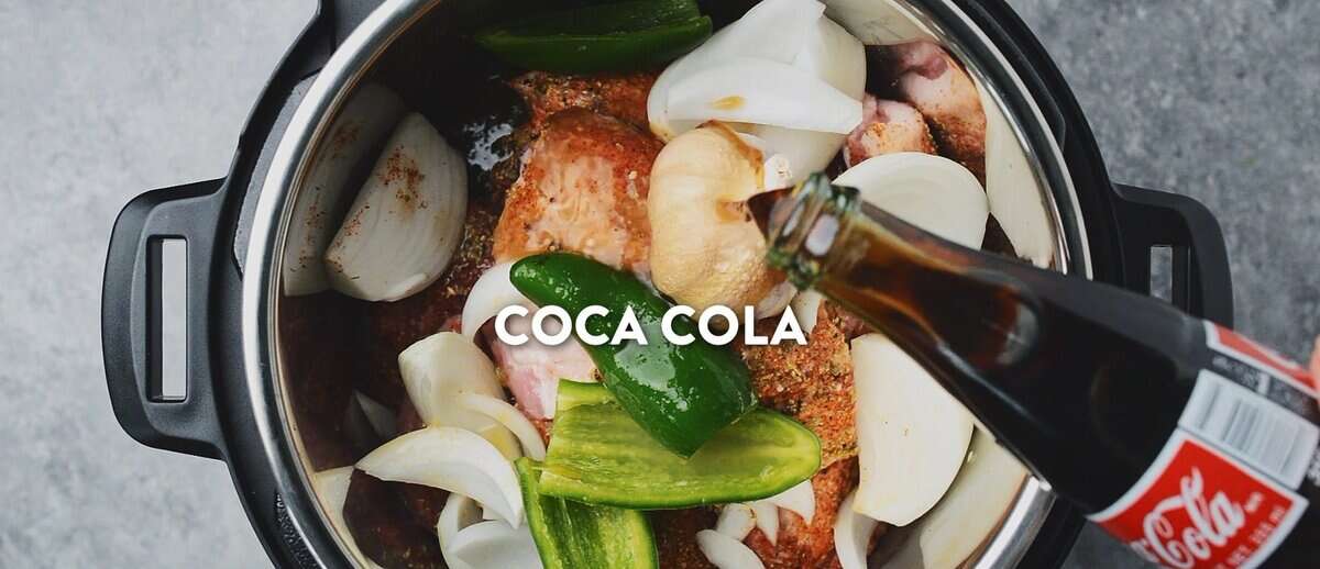 Instant pot carnitas with pork, onion, garlic, jalapenos, orange juice and Coke being poured into the pot. - 7